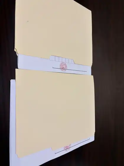Apostilled documents organized in folders by The Wet Ink Notary for clients in Southern California