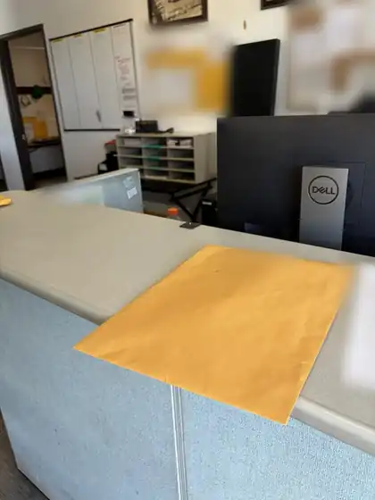 Registered process server Brent Hernandez serving court papers at a business, name and address blurred