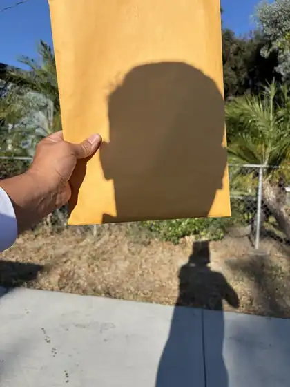 Process server holding legal papers for a San Bernardino case